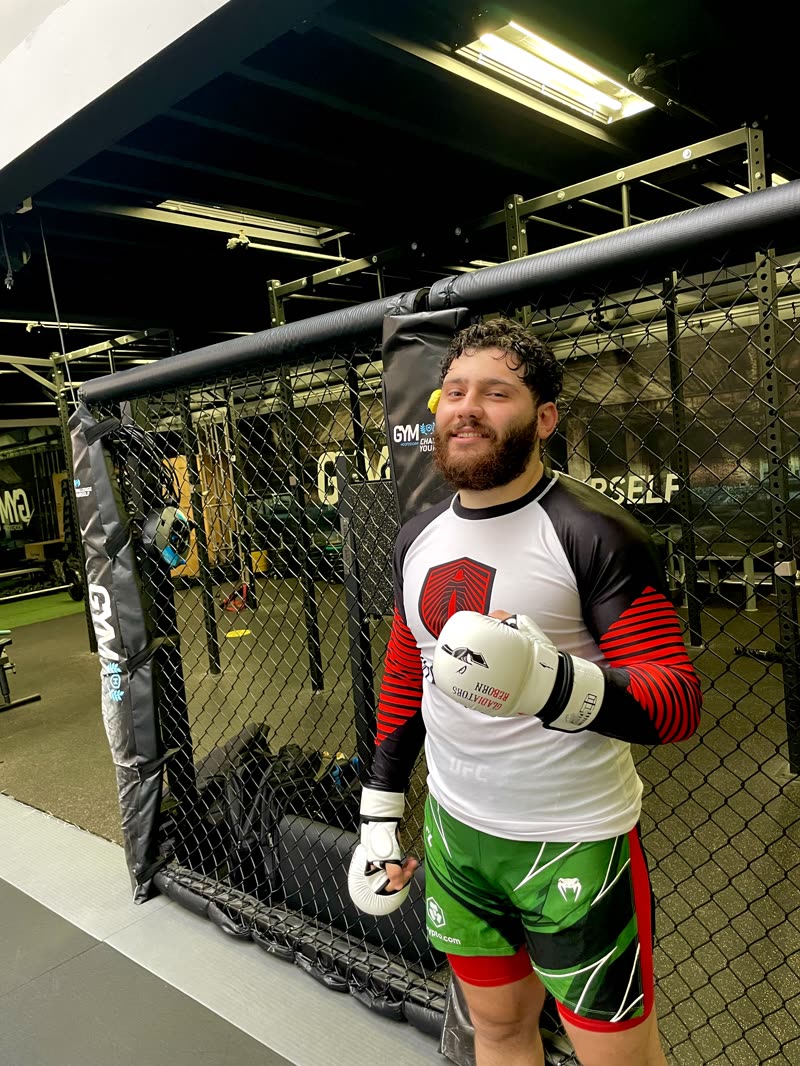 Fighter by the cage wearing the White Edition